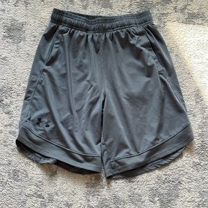 Four Under Armour gym shorts. Youth medium. Two grey and two black.